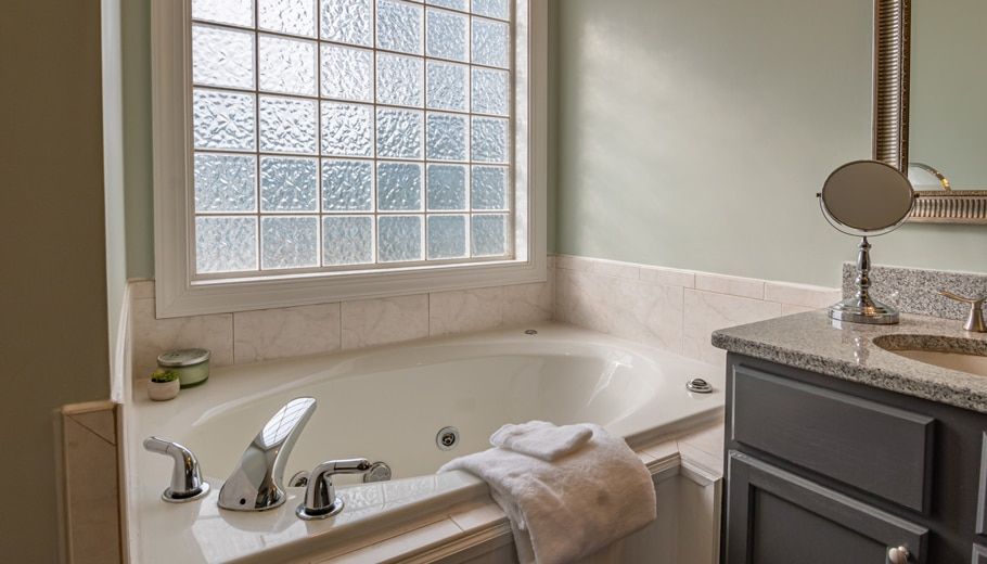 a Bathroom With a White Tub — Expert Plumbing & Solar Services Bathurst in Kelso, NSW