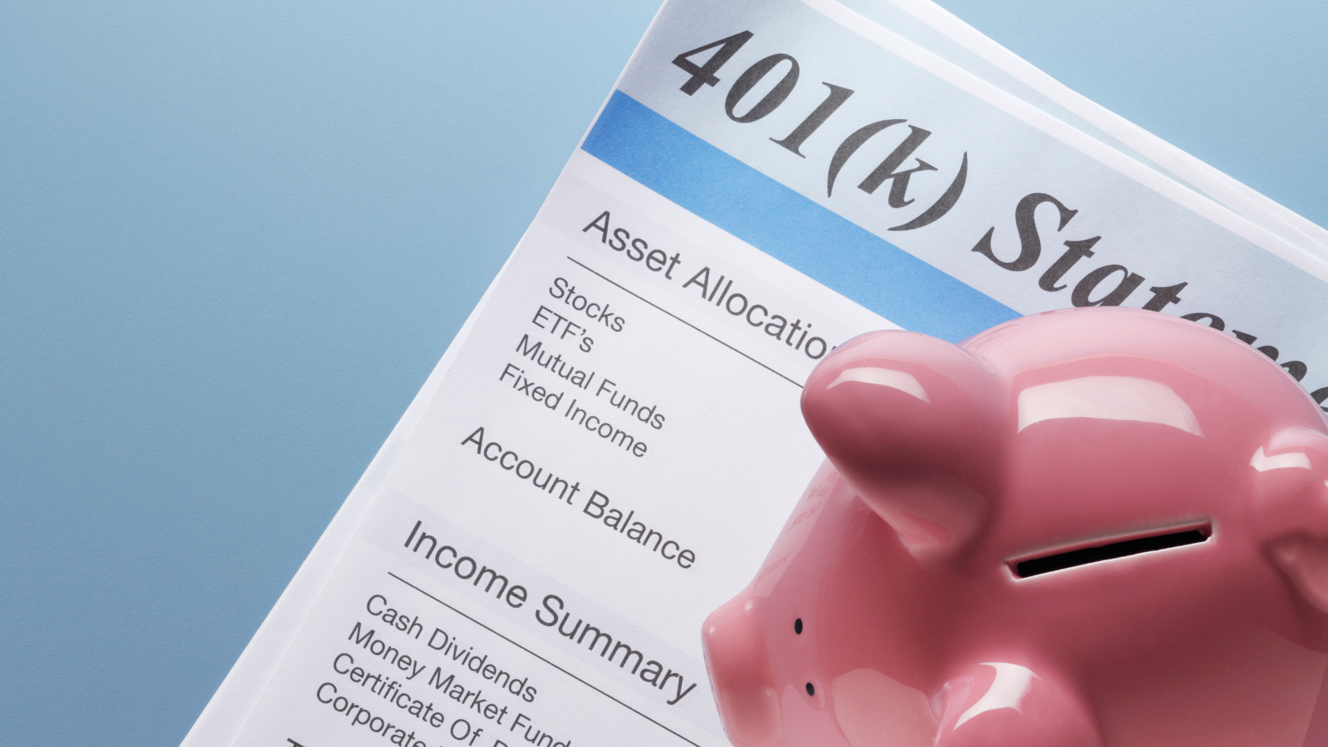 piggybank on top of a paper reading 