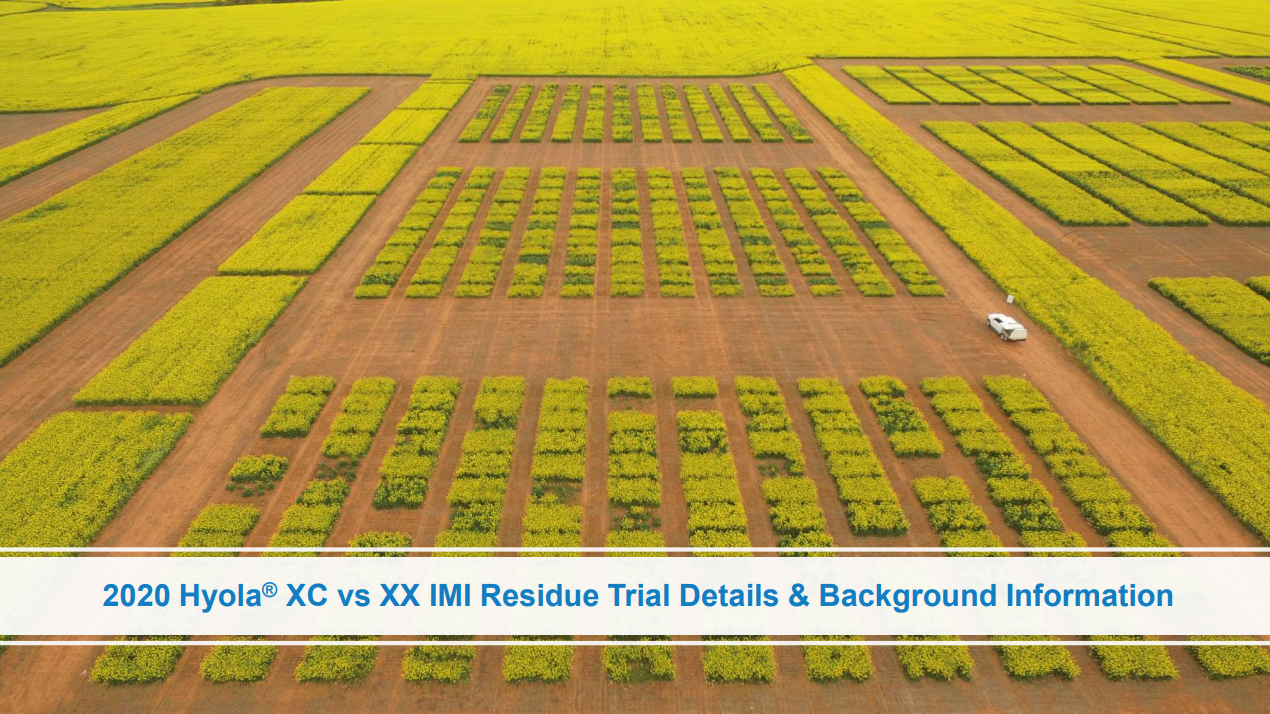 Aerial view of experimental crop plots in a field with a caption banner at the bottom