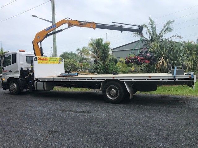 A Large Truck With a Crane on the Back is Parked — O'Grady's Transport & Removals in Alstonville, NSW