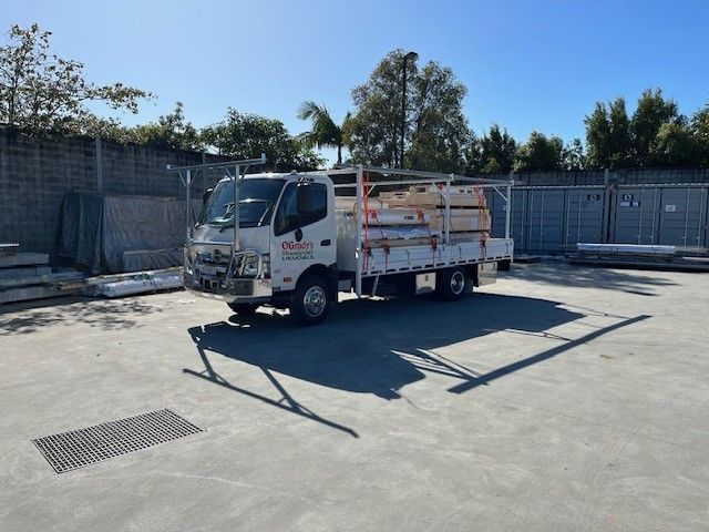 A White Truck is Parked in a Parking Lot — O'Grady's Transport & Removals in Byron Bay, NSW