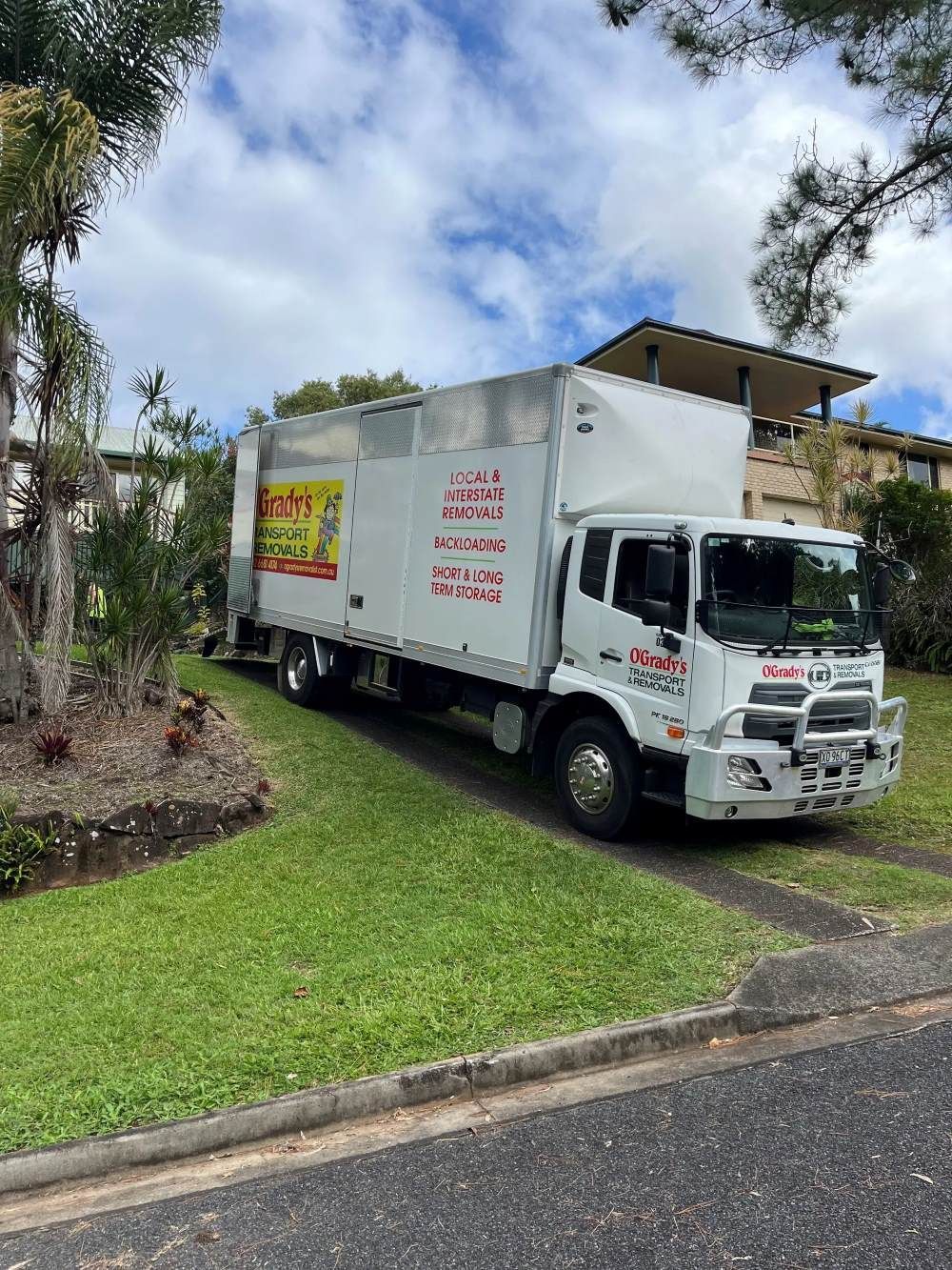 A White Truck With a Stack of Pallets on the Back — O'Grady's Transport & Removals in Sydney, NSW