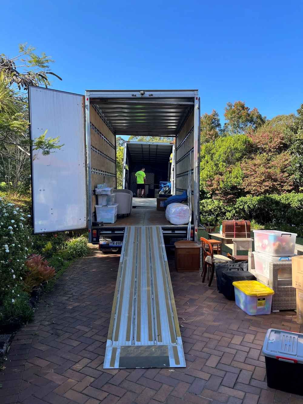 A Room Filled With Boxes, Chairs, and a Lamp — O'Grady's Transport & Removals in Yamba, NSW