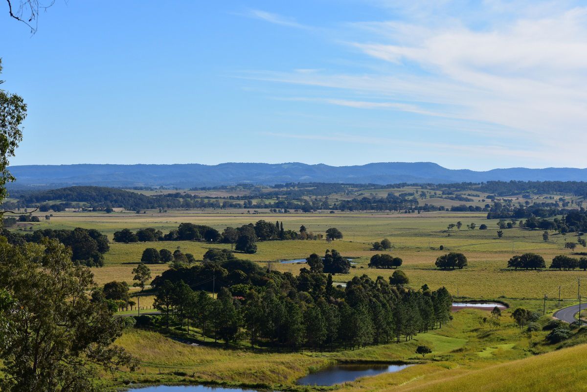 A Large Body of Water Surrounded by Trees and Rocks — O'Grady's Transport & Removals in Lismore, NSW