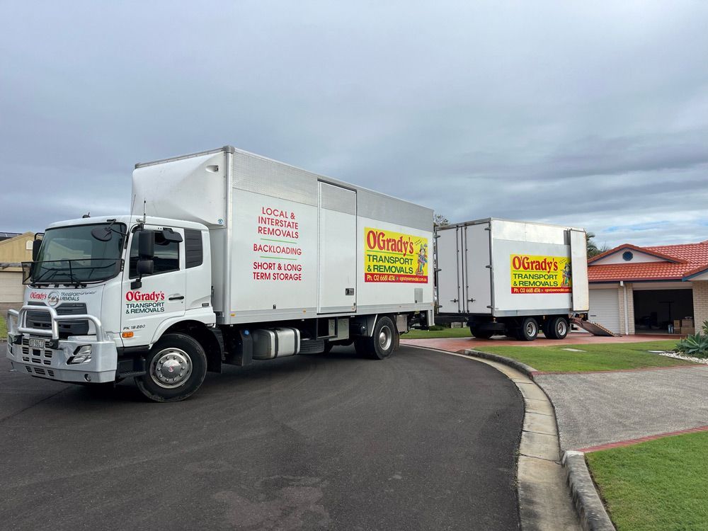 Transport Trucks Outside a Residential House
