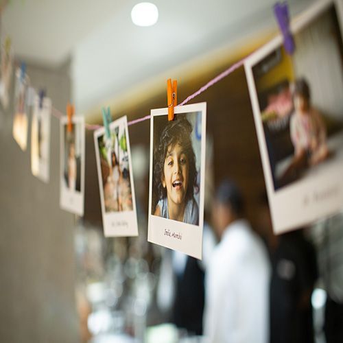 Close up of photos hanging on line, memories
