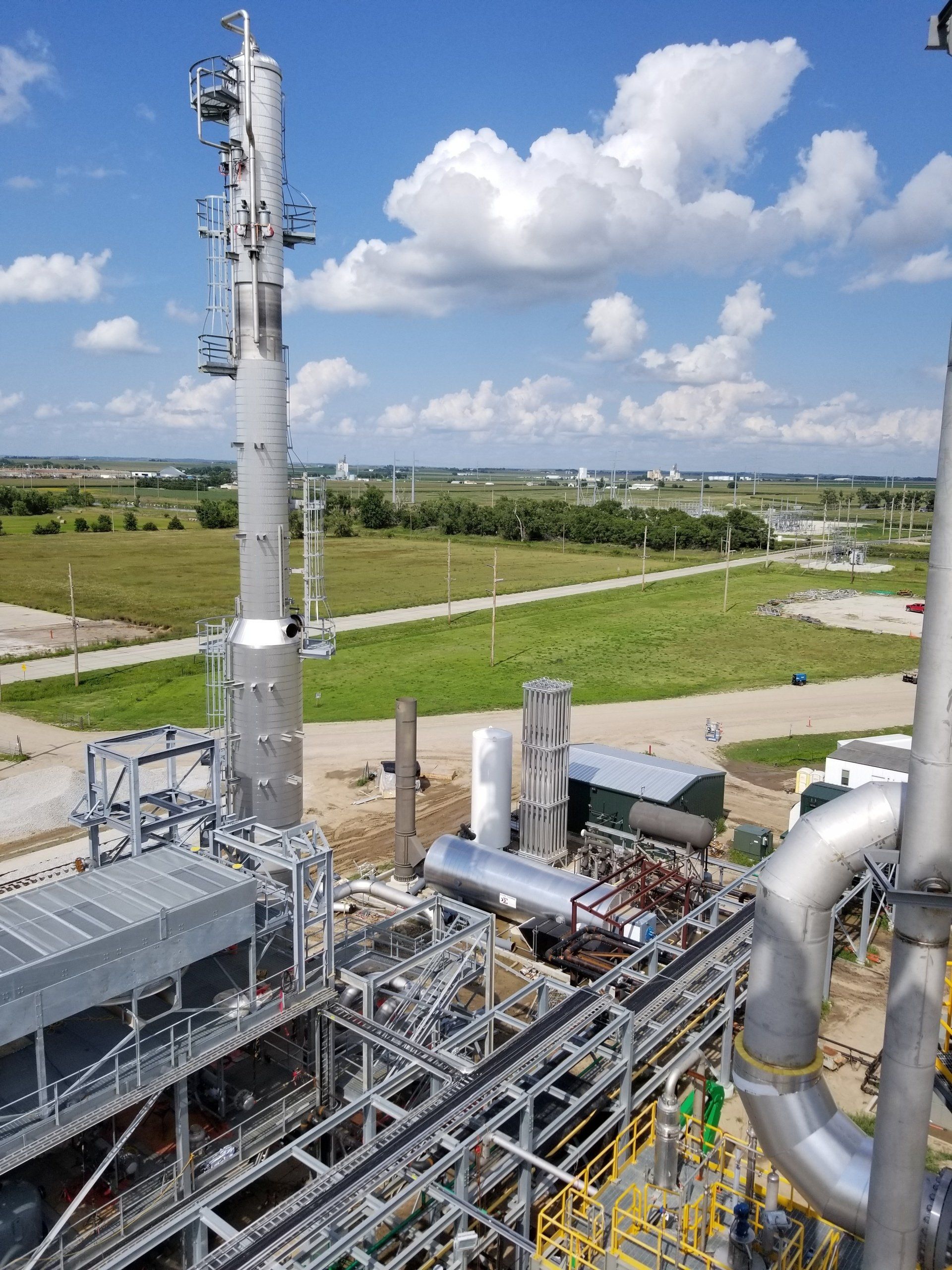 An aerial view of a factory with a lot of pipes