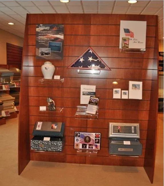 A wooden wall with various items on it including an american flag