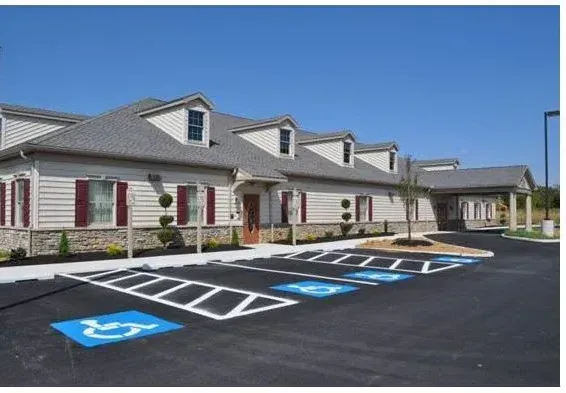 A building with a handicapped parking spot in front of it