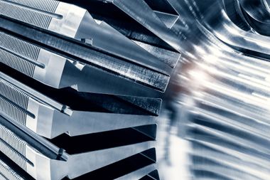 Close-up of reflective metal blades with bright light and motion blur
