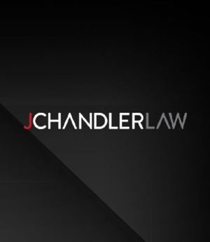 JChandlerLaw logo in white and red on a dark gray background with diagonal shadow