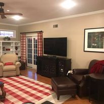 A living room filled with furniture and a flat screen tv.