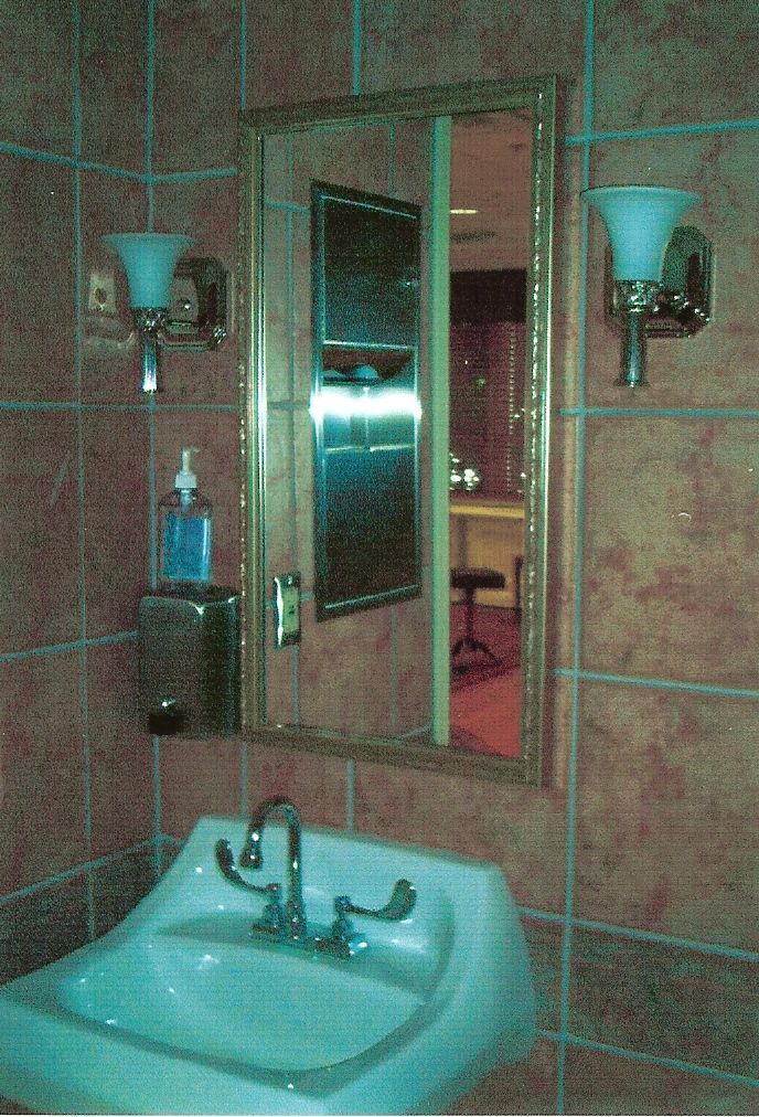 A bathroom sink with a mirror above it