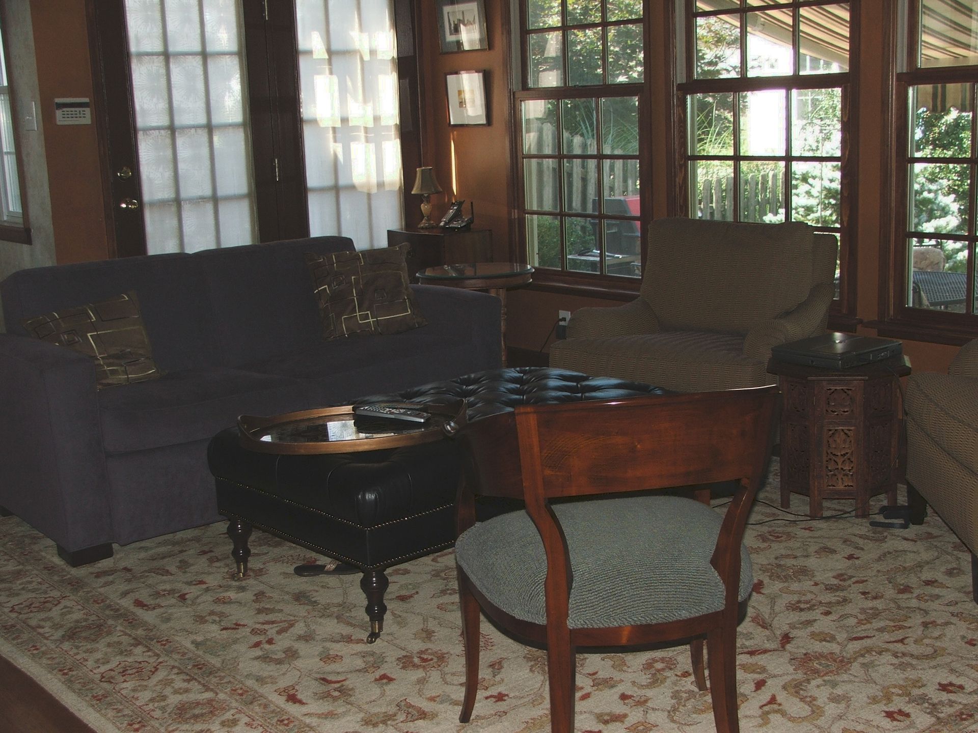A living room with a couch a chair and a table