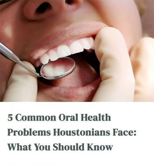 A woman is getting her teeth examined by a dentist