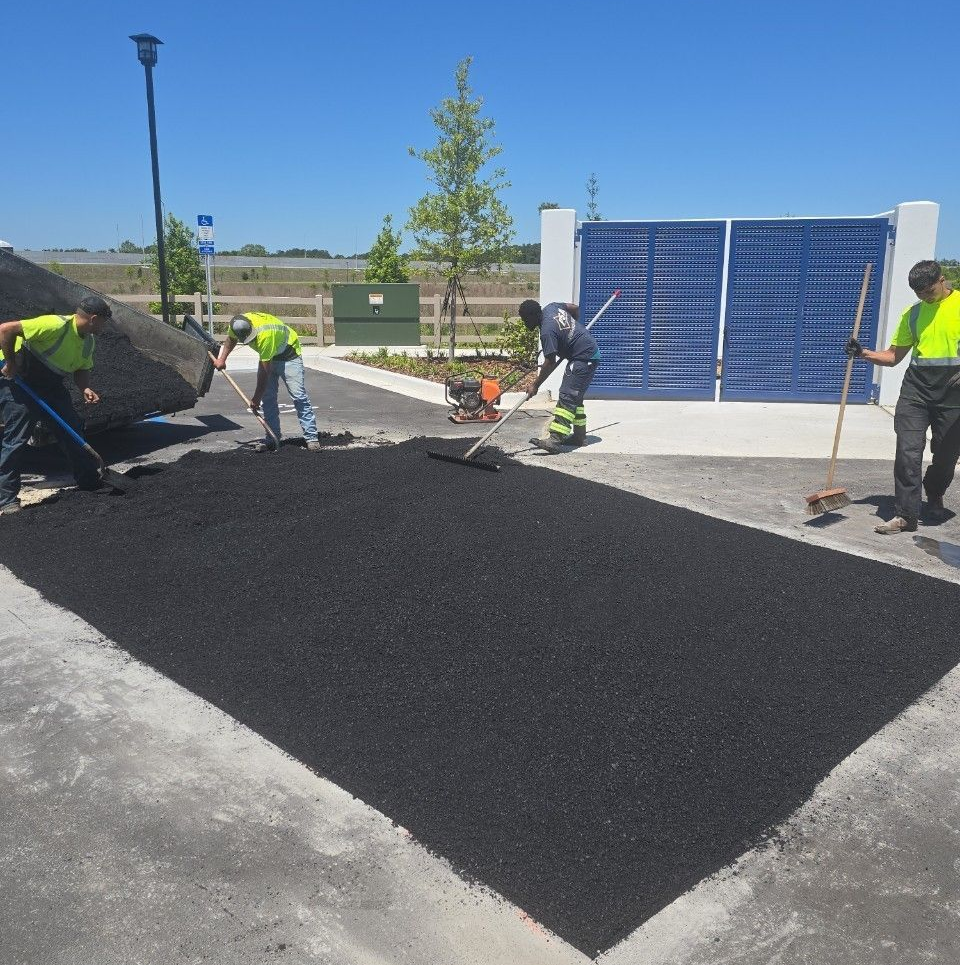 Man Repairing Asphalt Paving — Jacksonville, FL — Pro Sealed Asphalt Inc. Man Repairing Asphalt Paving — Jacksonville, FL — Pro Sealed Asphalt Inc.