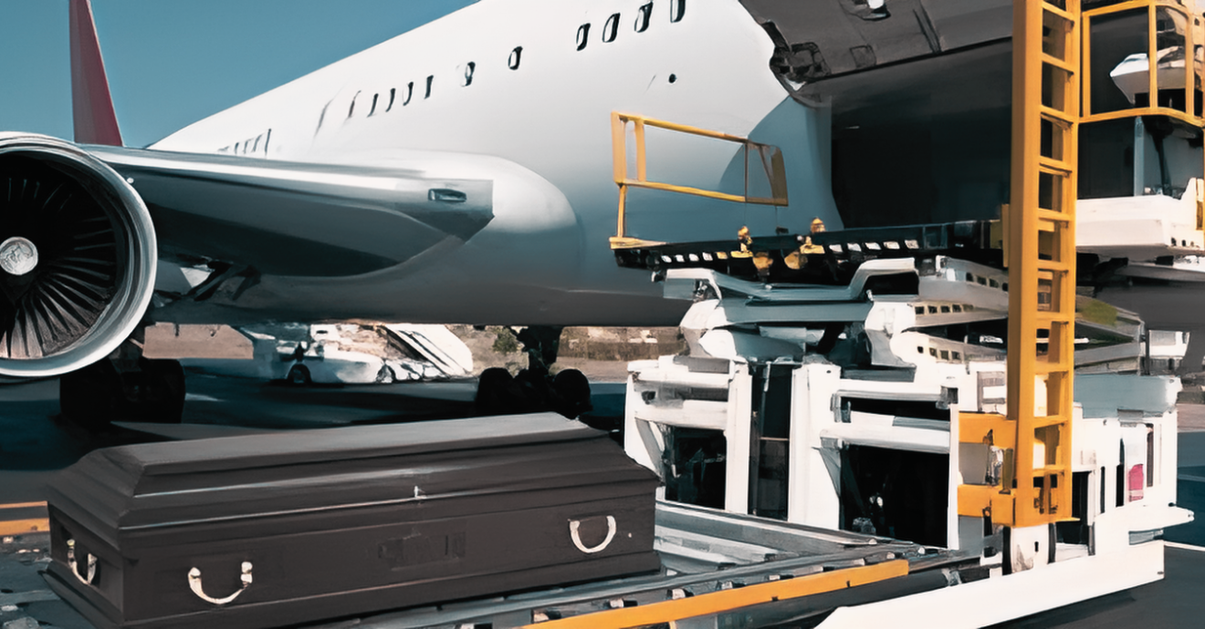 Baggage loader lifting suitcases into a passenger airplane at the airport terminal