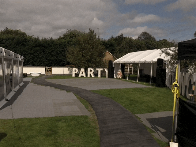 The word party is written in large letters on the side of a road