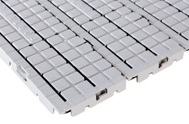A close up of a white tile floor