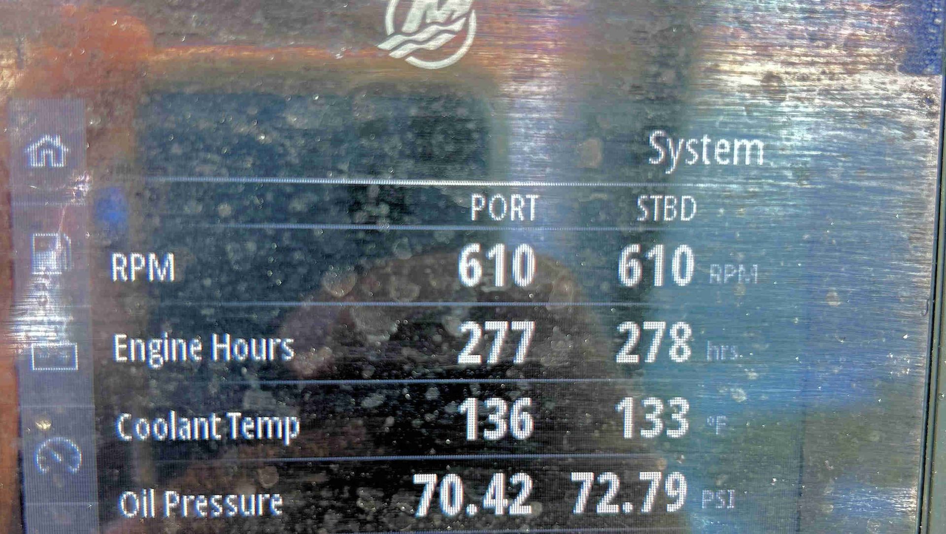 Boat engine dashboard showing port and starboard RPM, engine hours, coolant temp, and oil pressure readings.