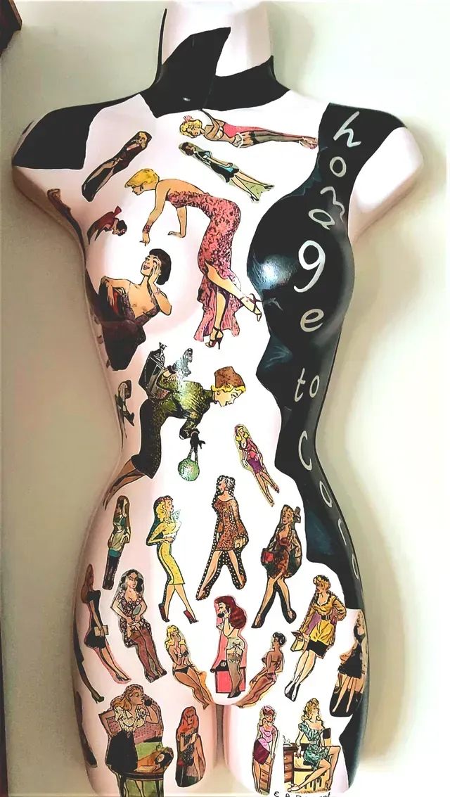 Patterned dress form covered in colorful cartoon figures, with black side panels and the word “hope” on one side