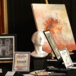 painting and statue of bust