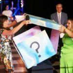 women opening a mystery box