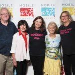 five people posing for photo
