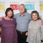 three people posing for photo