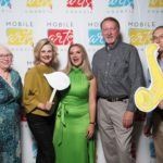 five people taking a fun photo