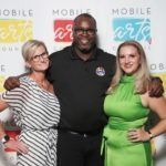 three people posing for photo