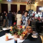 people around table with food