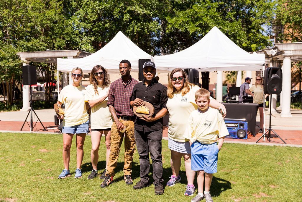 group of people with trophy