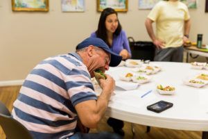 man eating tacos