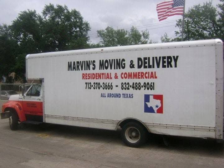 Marvin's Moving & Delivery box truck parked outdoors with a U.S. flag flying above.