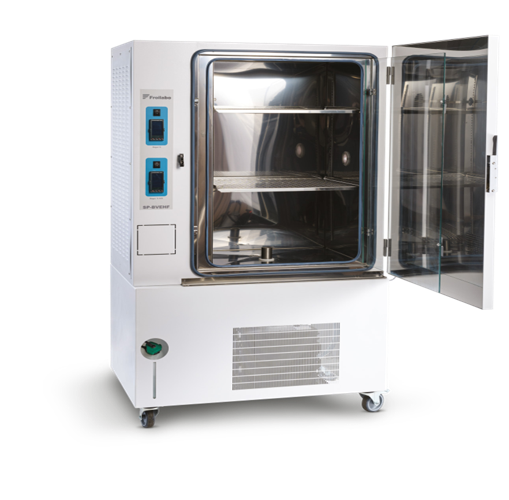 White laboratory drying oven with open door and metal shelves on wheels