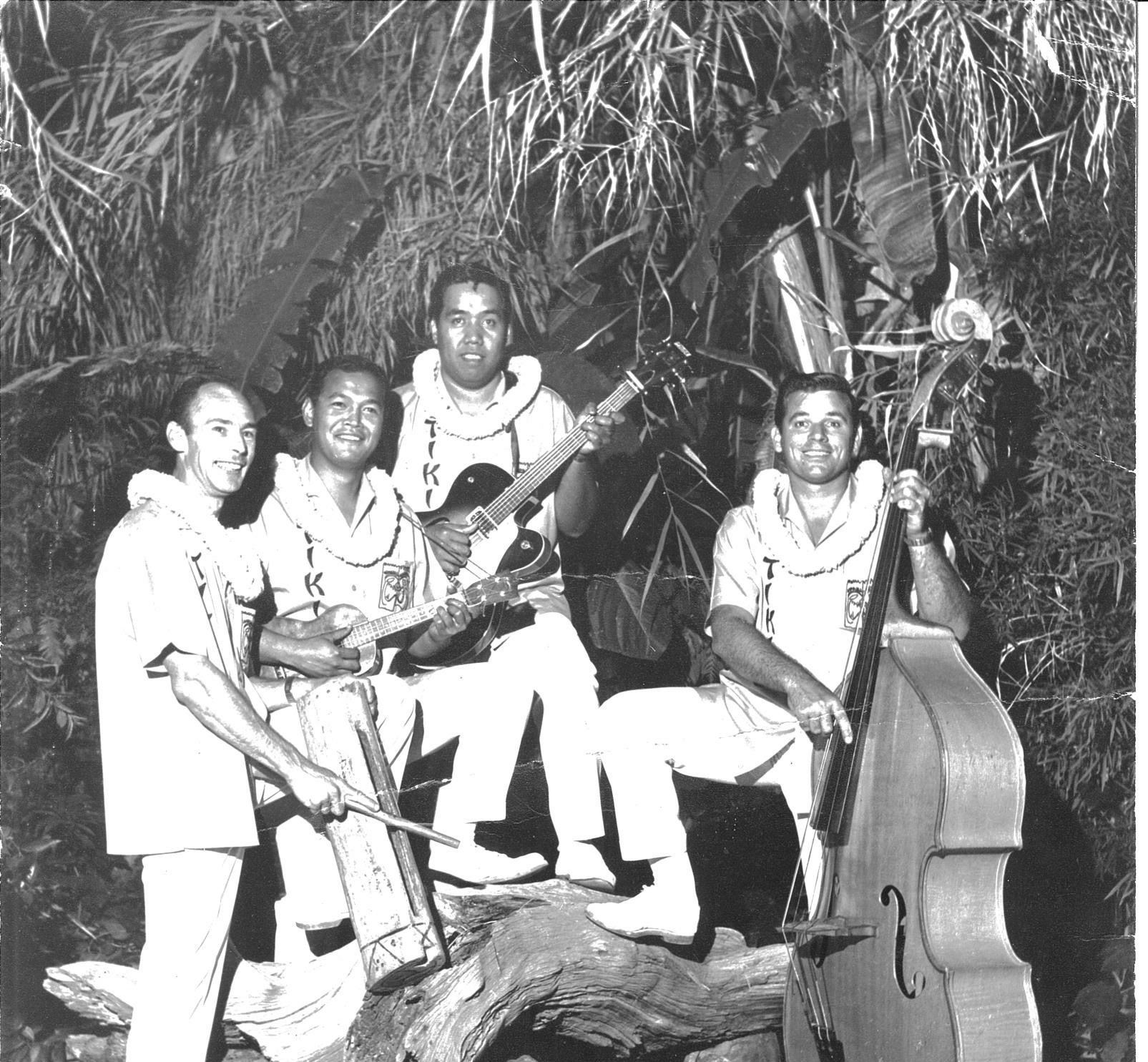 A black and white photo of a group of men playing instruments