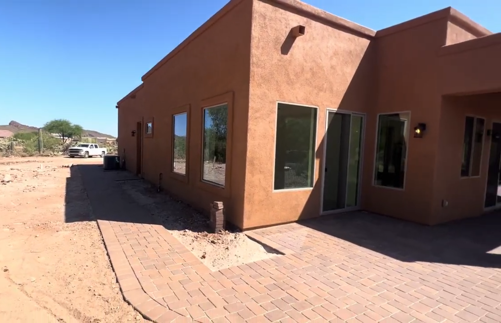 A large brown house with a lot of windows