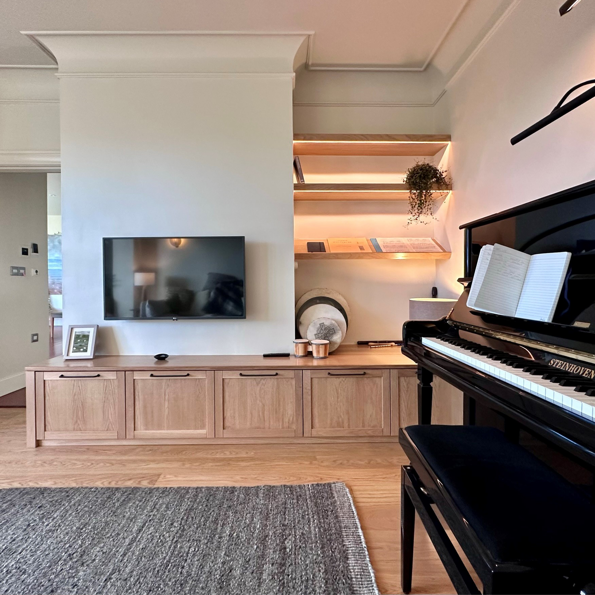 Living room - Oak cabinet and shelving with lights