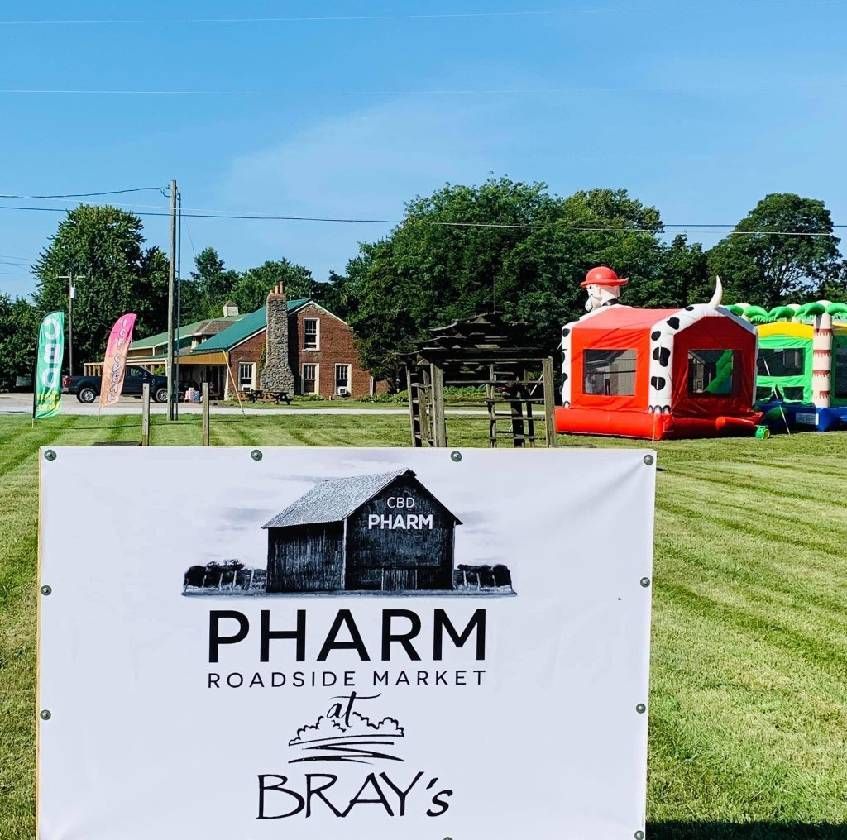 A sign that says pharm roadside market on it