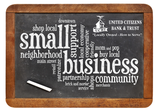 A chalkboard with the word small business written on it