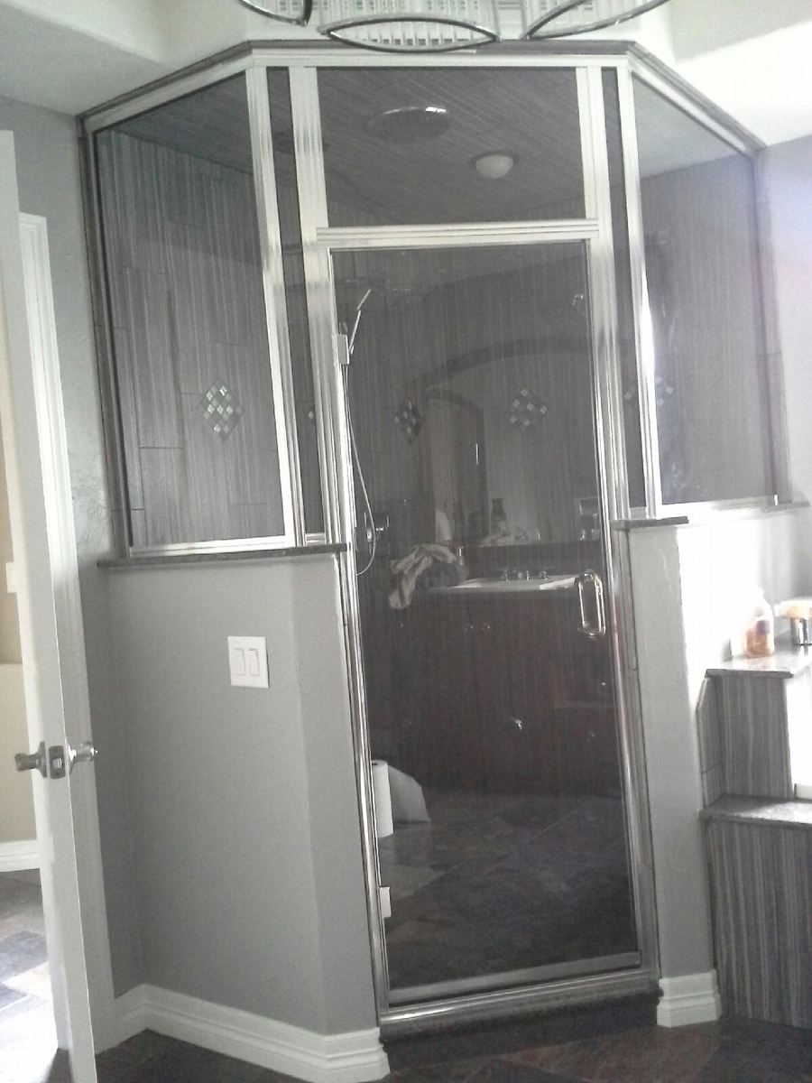Walk-in closet with a mirrored sliding door, gray walls, and white trim.