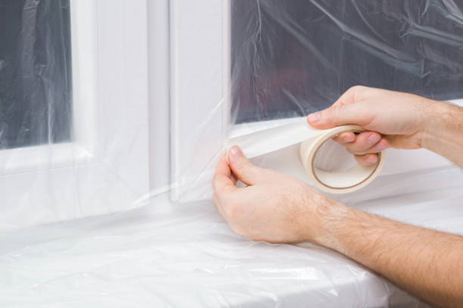 Person holding plastic roll in window at Ram Glass, Fort Collins, CO - Window Repair Fort Collins Co