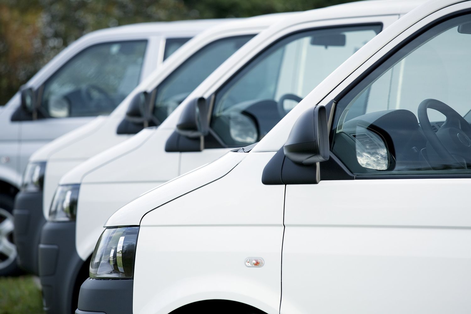 Row of White Vans — Lafayette, IN — Stay Clean Mobile Detailing