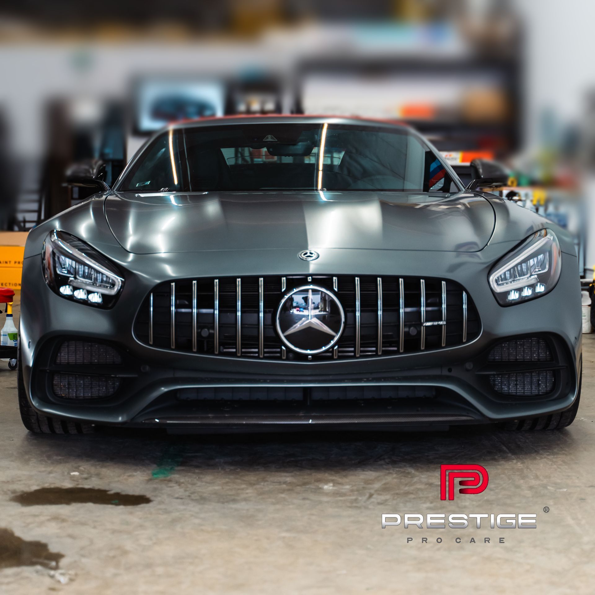 A mercedes benz sports car is parked in a garage