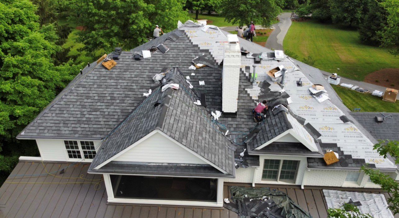 Aerial view of back side of workers working on roof — Georgetown, IN — ARC Roofing LLC
