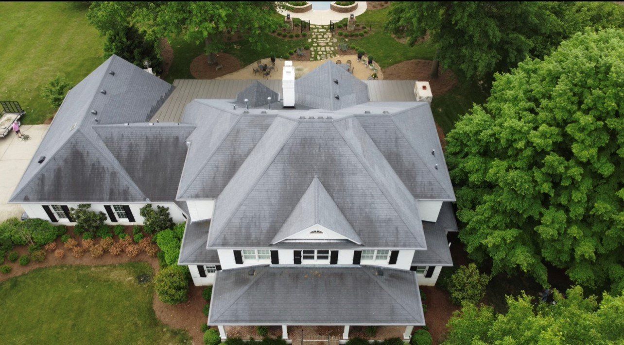 Far aerial view of large mansion with gray roof — Georgetown, IN — ARC Roofing LLC