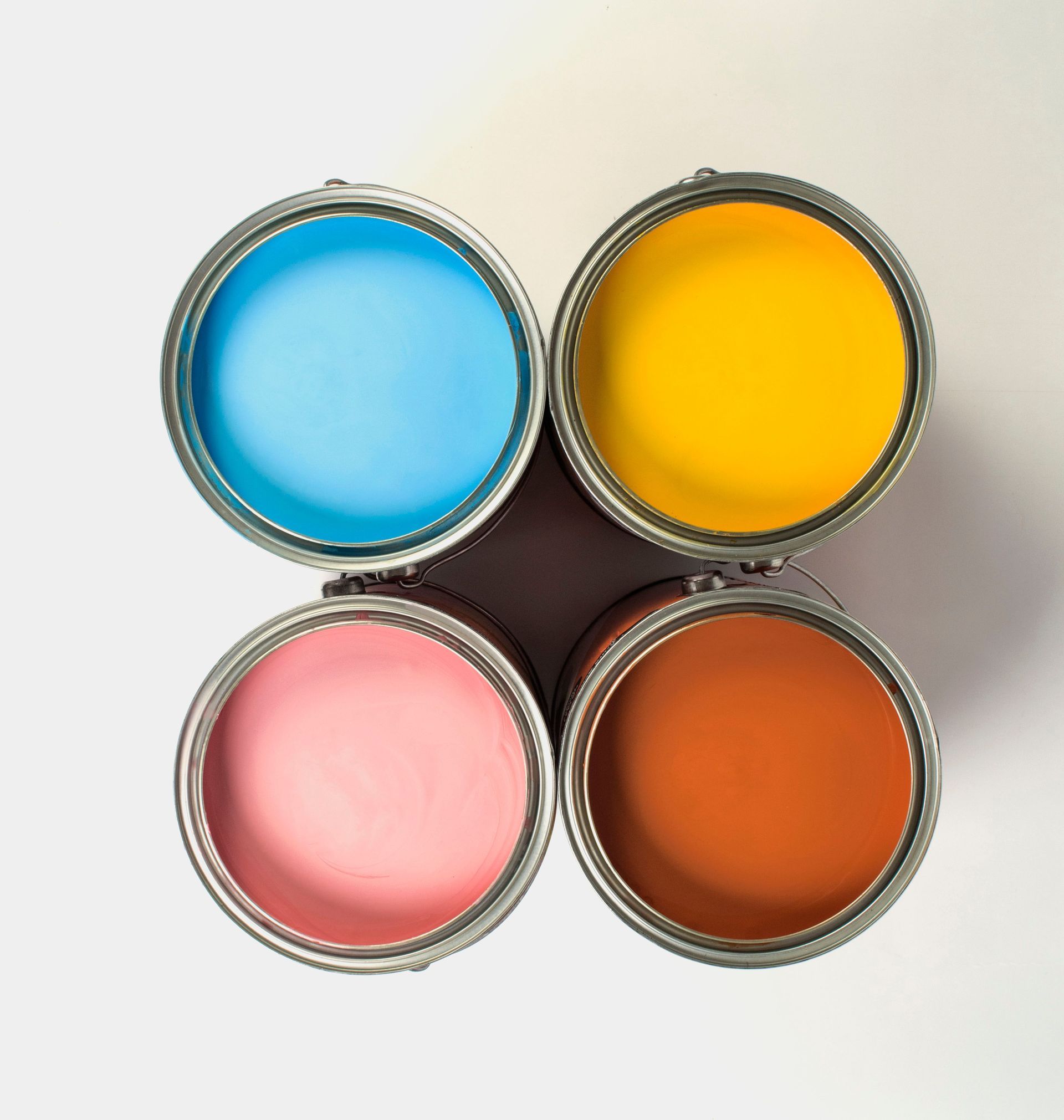A room with drywall on the walls and a bucket of paint on the floor.