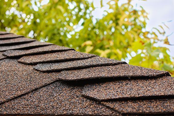 Brown asphalt roof shingles by Team Roofing NW in Kent, WA.