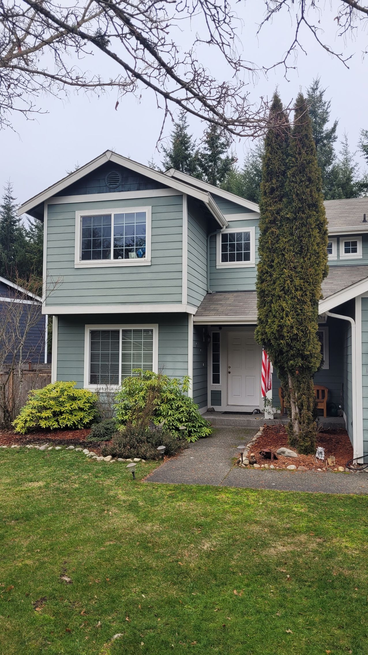Damaged asphalt shingles before repair by Team Roofing NW in Kent, WA.
